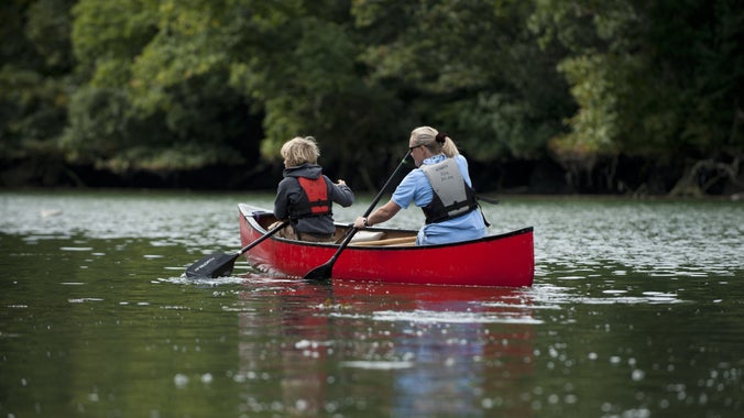 Canadian canoes on Pont Pill in the Fowey estuary, Cornwall.